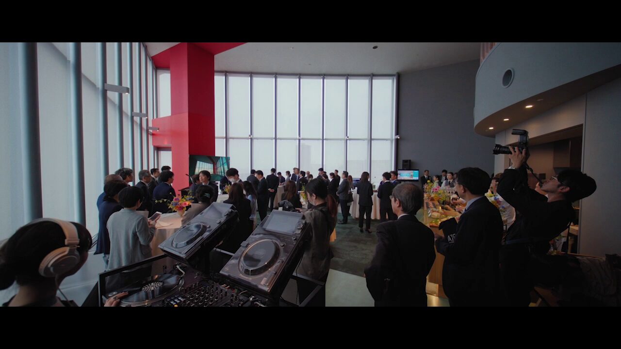 Busy hotel lobby with business travelers and luggage showing privacy challenges for confidential VIP arrivals