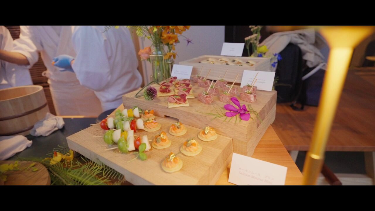 Professional commercial kitchen layout showing industrial ranges, refrigeration units, and prep counters for event catering
